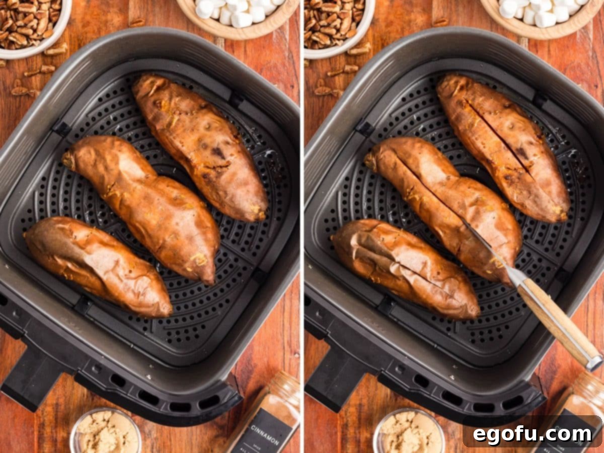 Air fried sweet potatoes and sliced open sweet potatoes in an Air Fryer basket.