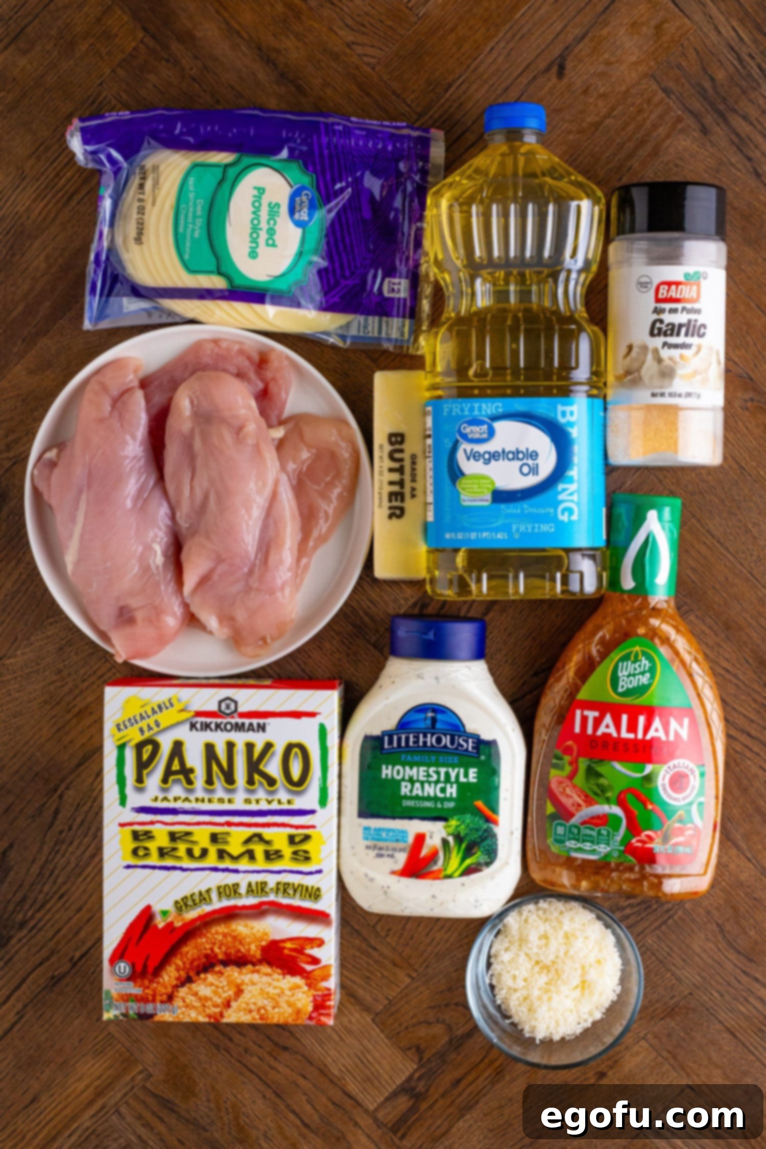 Longhorn's Crispy Parmesan Crusted Chicken 4 Chicken breasts, panko bread crumbs, Italian dressing, ranch dressing, vegetable oil, provolone cheese, parmesan cheese, garlic powder, and salted butter.