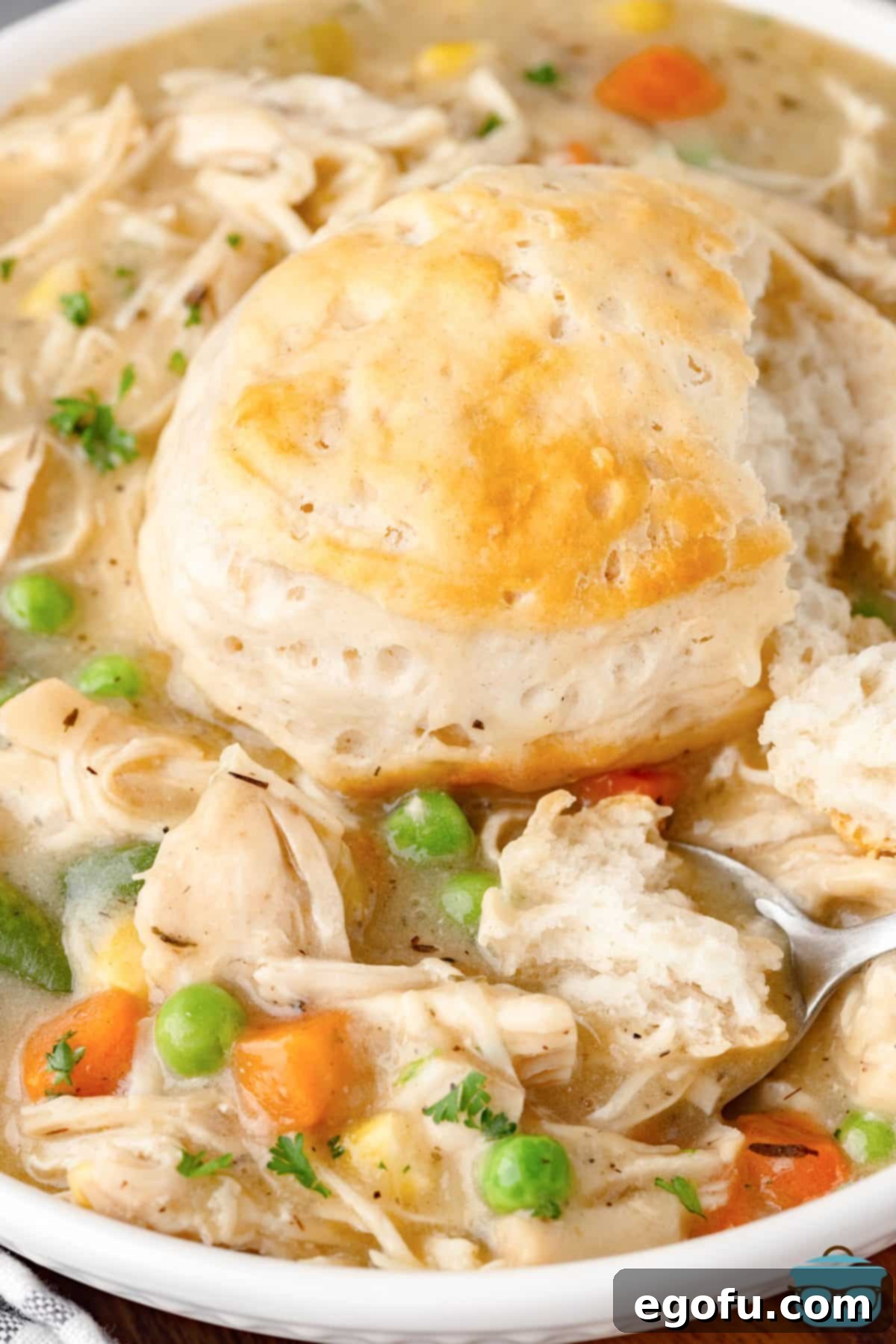 A beautifully presented bowl of Instant Pot Chicken Pot Pie, topped with a golden-brown biscuit, ready to be enjoyed.