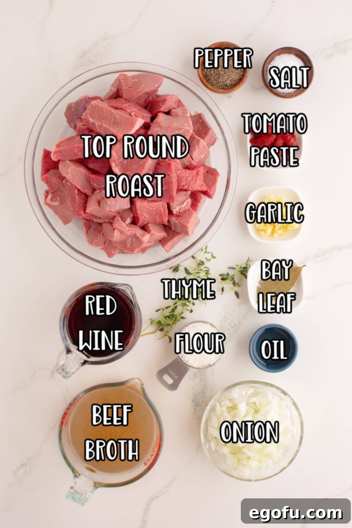 Top round roast, vegetable oil, onion, tomato paste, garlic cloves, flour, red wine, beef broth, salt, pepper, thyme and bay leaves. 