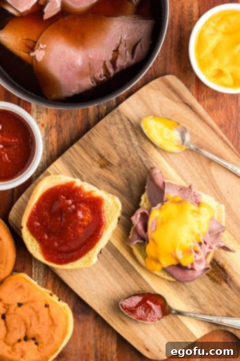 Sauces being added to sandwich.