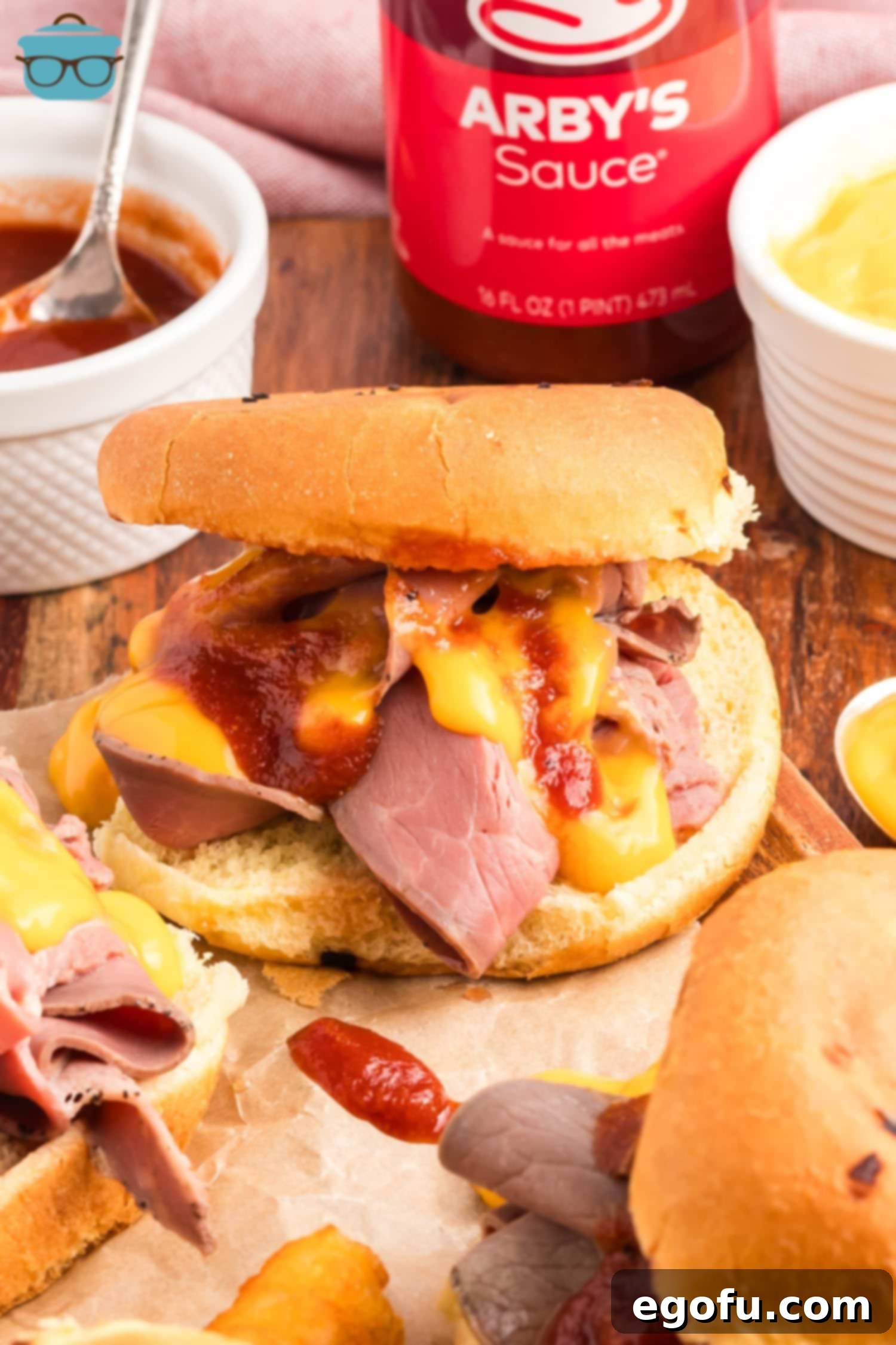 An overflowing Arby's Roast Beef and Cheddar.