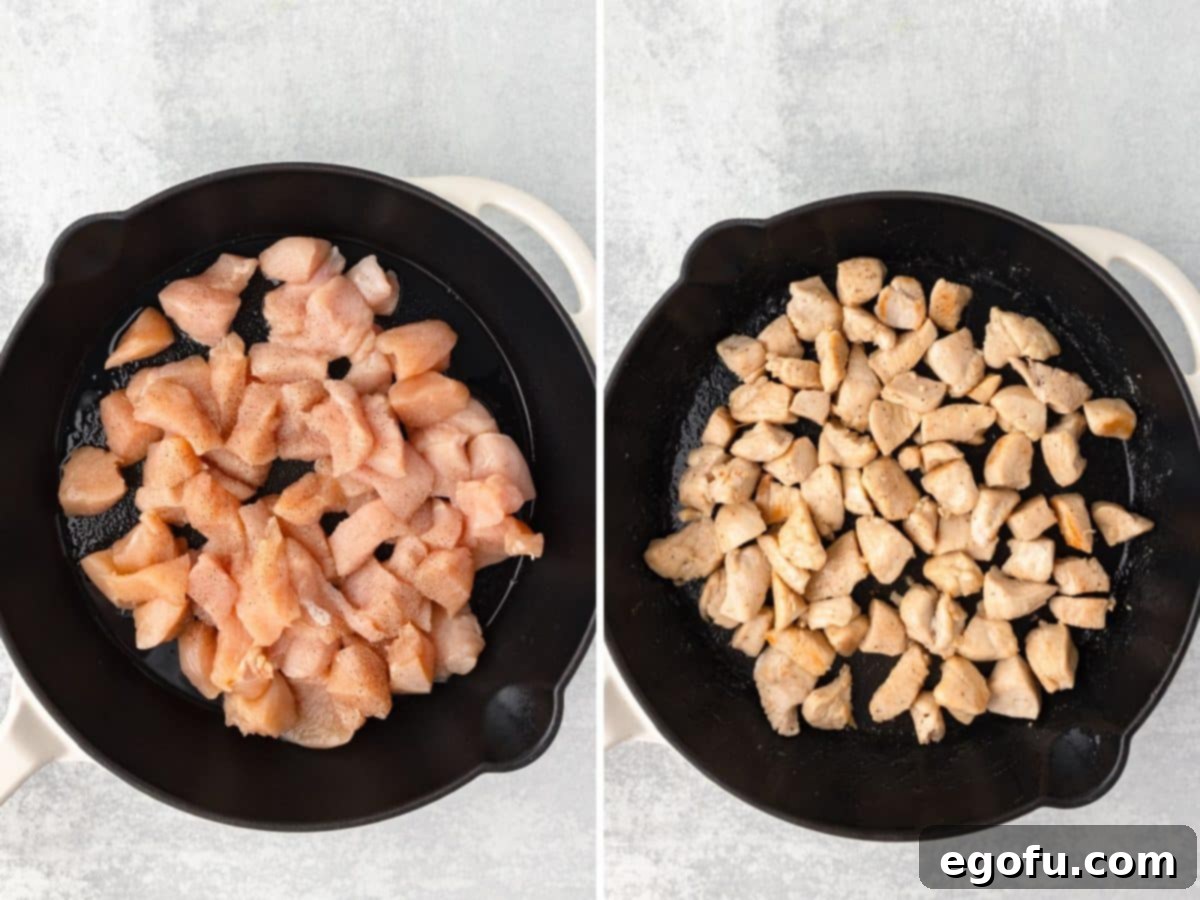 Chicken being cooked and seasoned with salt and pepper in a skillet.