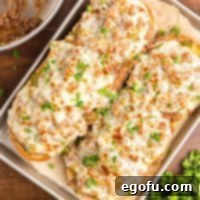Closely looking down on a few slices of Philly Cheesesteak Garlic Bread.