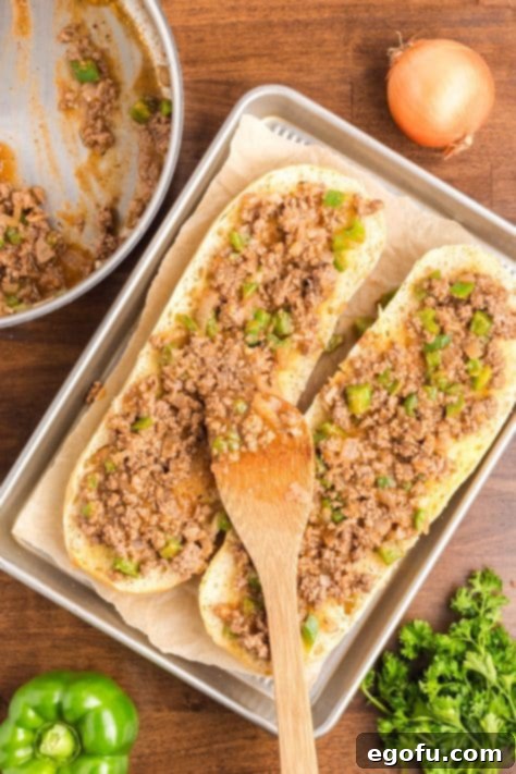 Meat mixture on a loaf of bread.