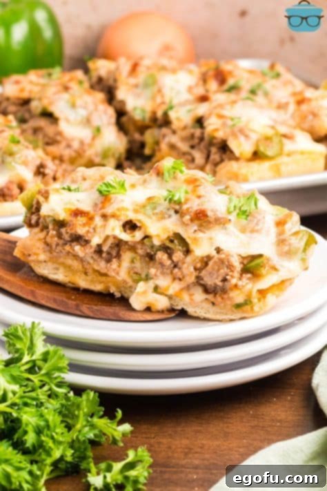 A slice of Italian loaf Philly Cheesesteak Garlic Bread.