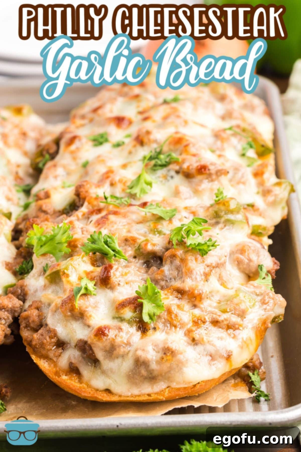 A small pile of Philly Cheesesteak Garlic Bread slices.