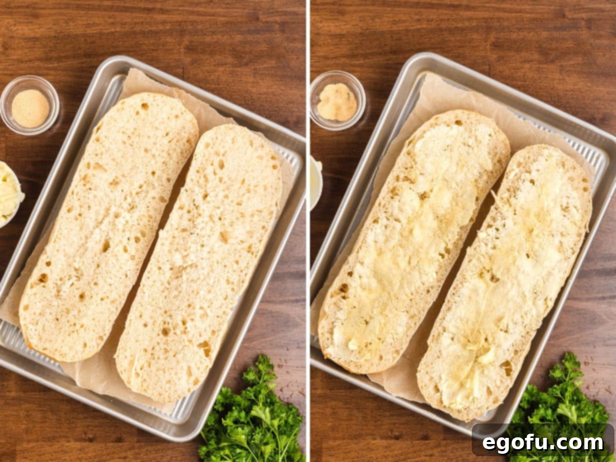 A loaf of Italian bread cut lengthwise with butter and garlic powder. 