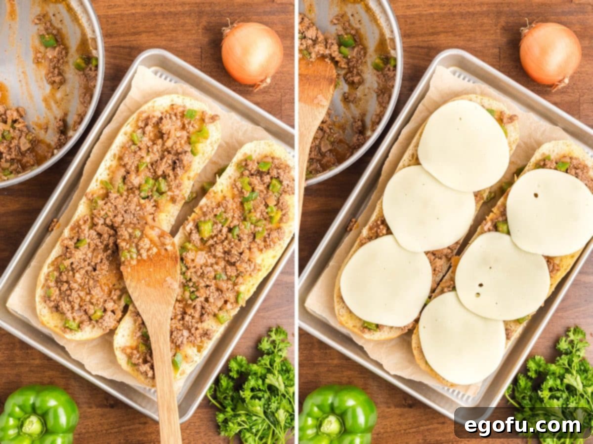 Some of the meat mixture on the Italian Loaf and it topped with provolone cheese. 