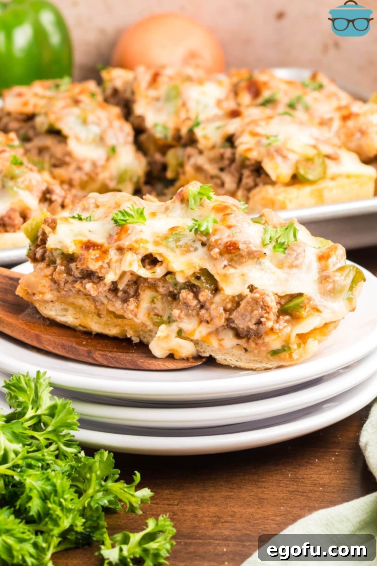 A slice of Italian loaf Philly Cheesesteak Garlic Bread. 