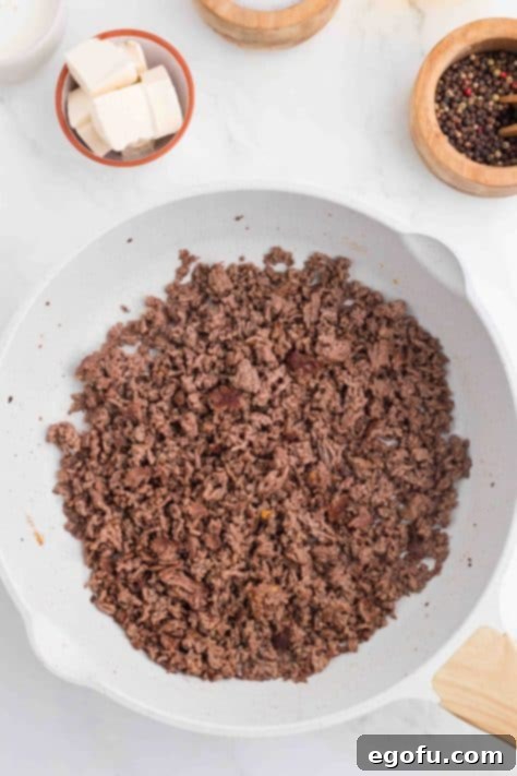 Ground beef in a skillet.