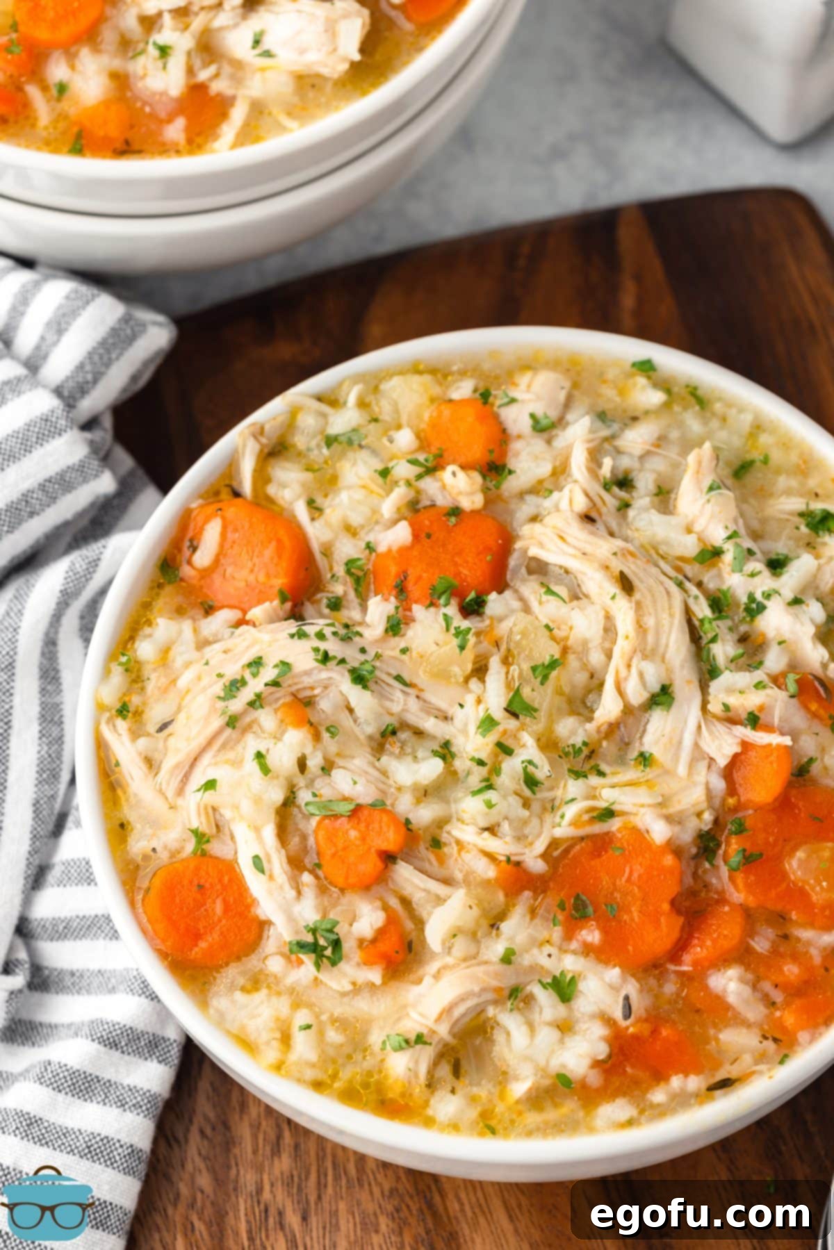 Comforting Instant Pot Chicken and Rice Soup 9 Looking down on a hearty bowl of Instant Pot Chicken and Rice Soup.
