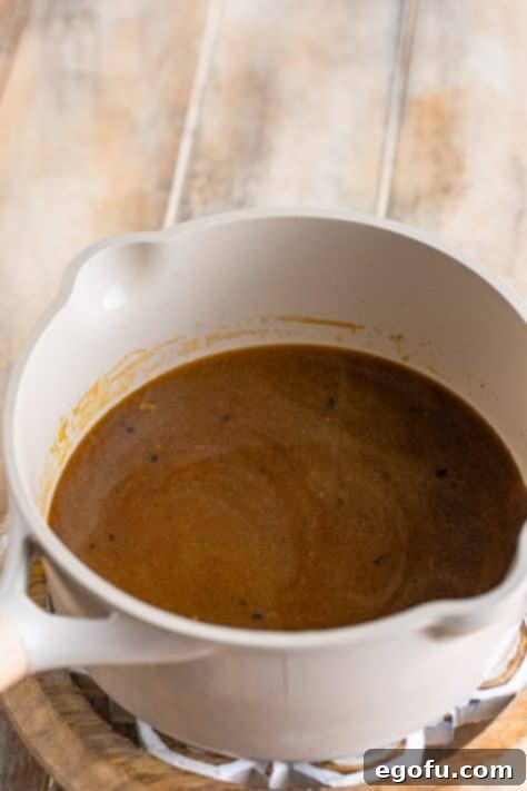 Gravy being made in a pot.