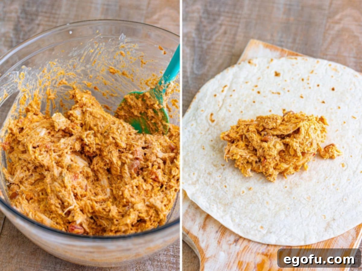 A large bowl filled with a creamy, seasoned mixture of shredded chicken, refried beans, melted cheese, taco seasoning, salsa, and sour cream, ready to be scooped onto tortillas, with a spoon mixing the ingredients.