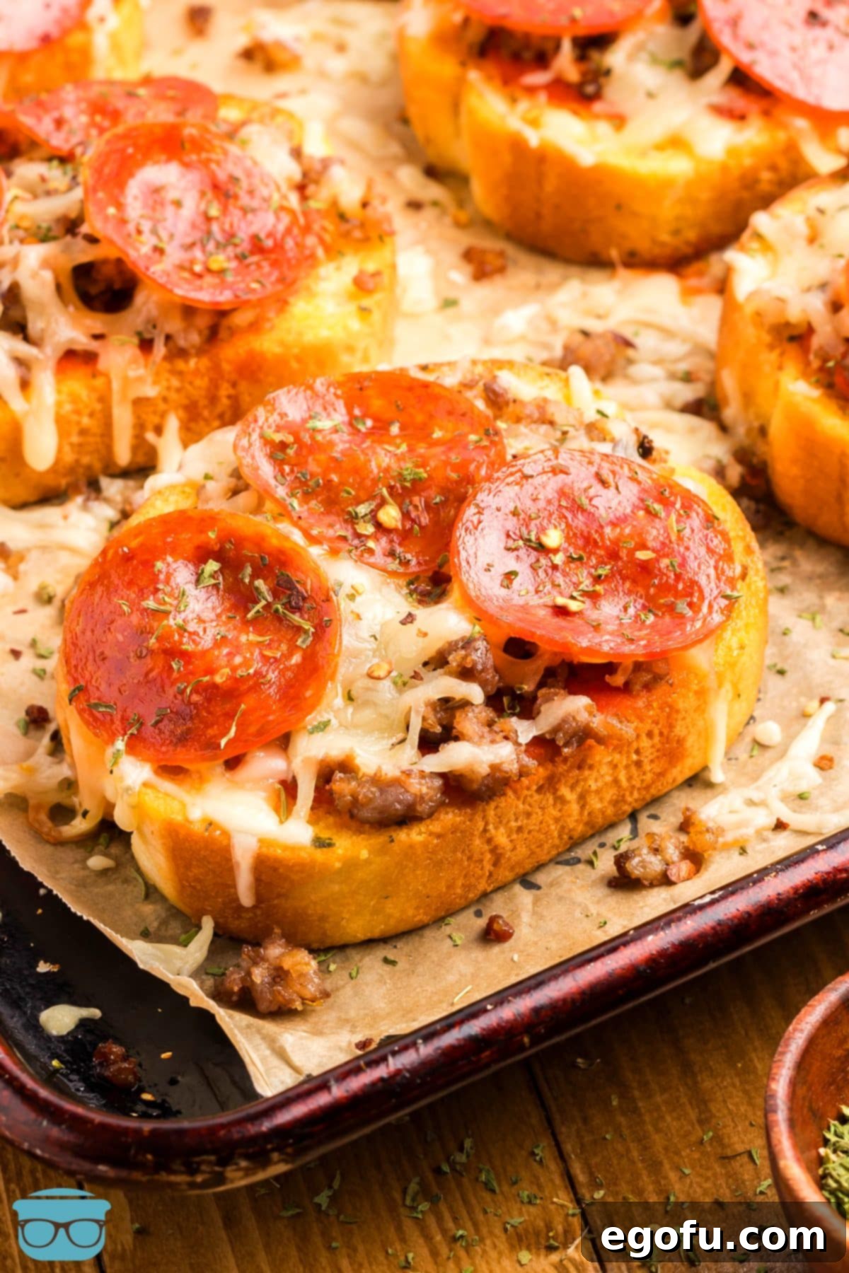 A few slices of homemade Garlic Texas Toast Pizzas, showcasing melted cheese, pepperoni, and a perfectly toasted crust.