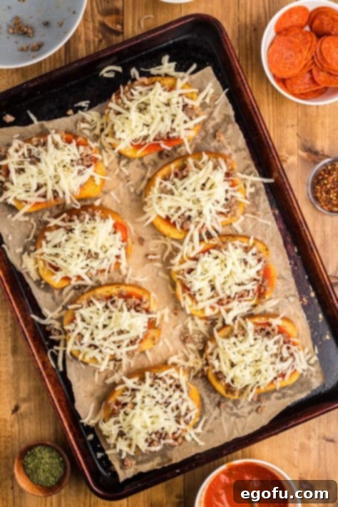 Garlic Toast with pizza sauce, sausage, and a generous layer of cheese.