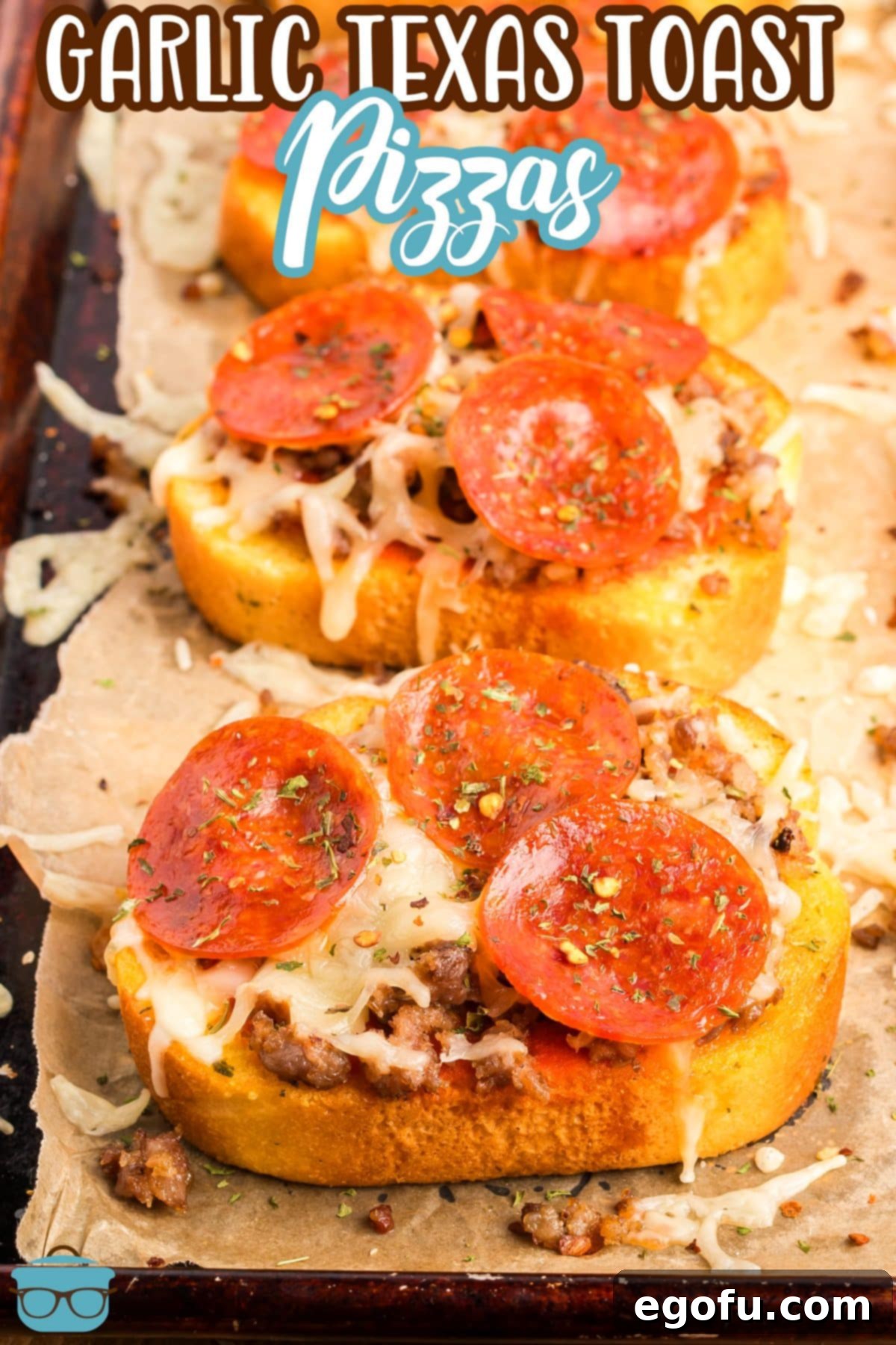 Looking down on two perfectly golden-brown Garlic Texas Toast Pizzas, topped with melted cheese, pepperoni, and fresh parsley.