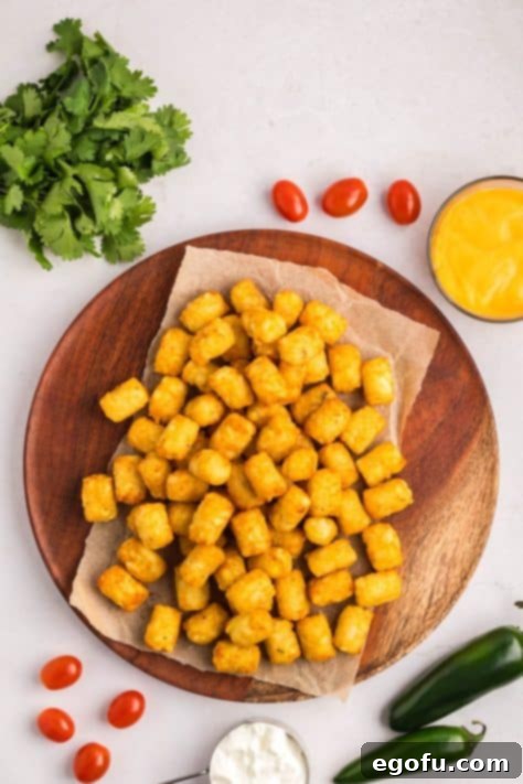 Tater tots on a piece of parchment.