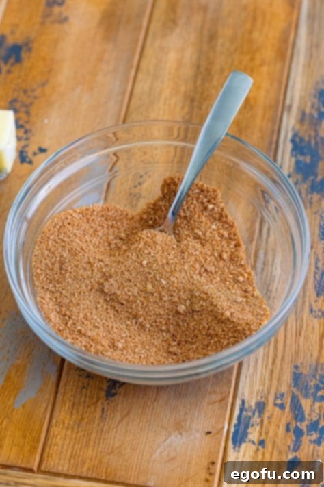 Homemade Brown Sugar Pop Tarts with a generous drizzle of cinnamon glaze, showcasing the finished product.