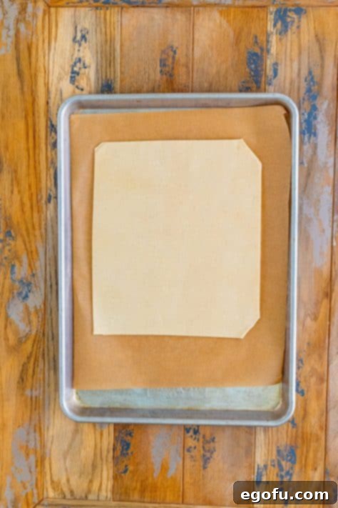 Rectangular pie crusts on a lined sheet pan.