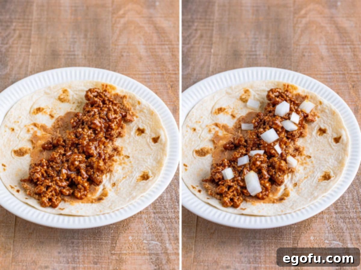 A tortilla layered with creamy refried beans, savory seasoned beef, and a scattering of fresh diced onions.