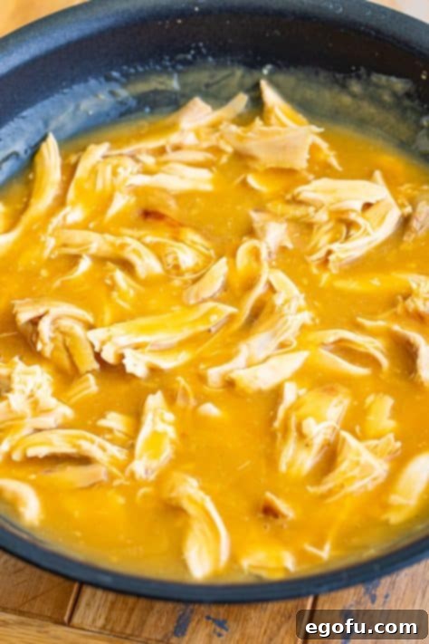 Island Topping Towers 9 Chicken simmering in a chicken gravy, coated in the sauce.