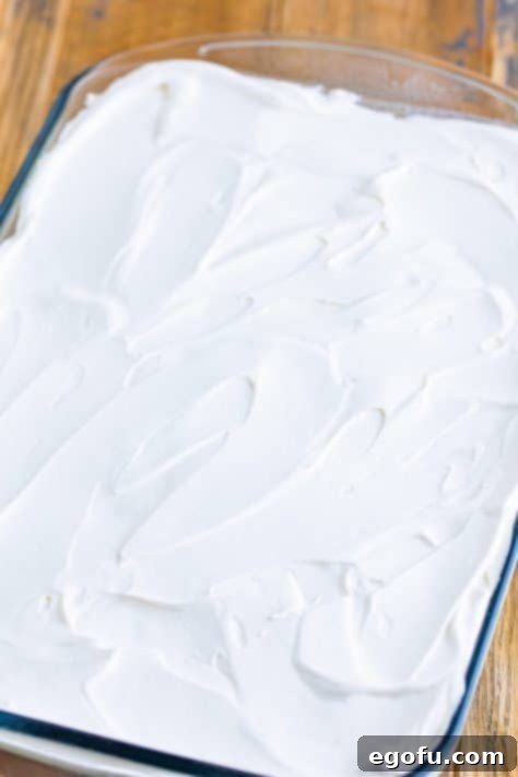 Whipped topping layer on a dessert.