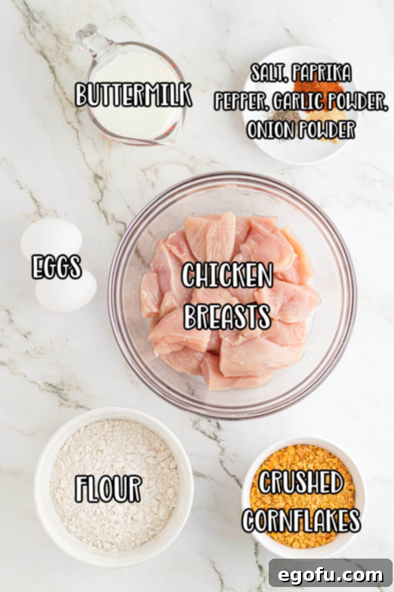 Chicken breast, buttermilk, garlic powder, onion powder, paprika, salt, pepper, flour, eggs, cornflakes, and oil. 
