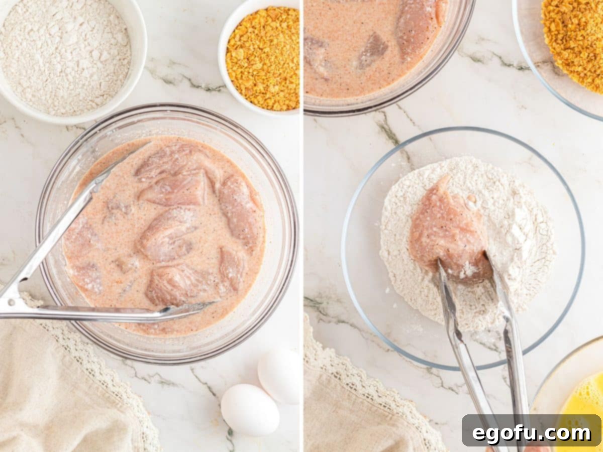 Chicken in marinade and tongs dredging piece of marinated chicken in flour mixture.