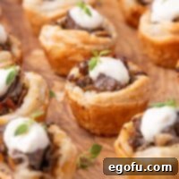 Close up looking at a few rows of Beef Wellington Bites.