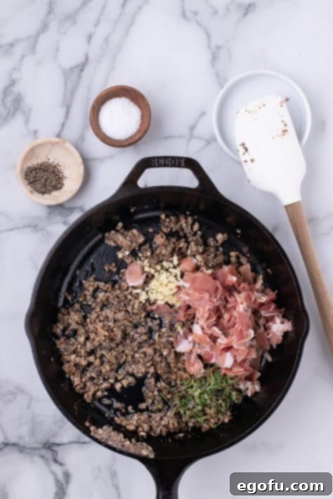 Mushroom mixture in a skillet.