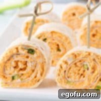 A few Buffalo Chicken Pinwheels with a toothpick holding them together.