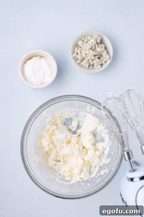 Beaten cream cheese in a bowl.