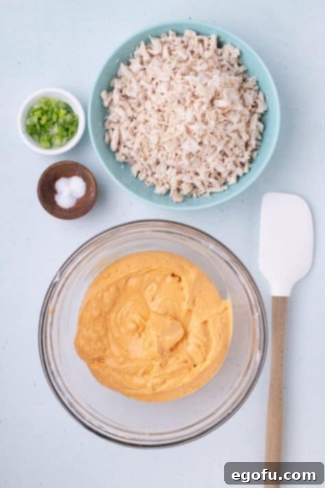 Buffalo sauce, lemon juice, cream cheese, blue cheese, and mayo n a cream cheese mixture.