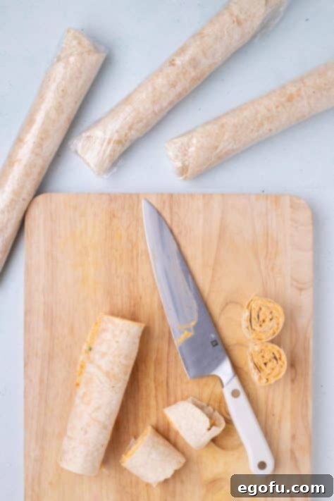 Tortillas with filling being cut into smaller pieces.