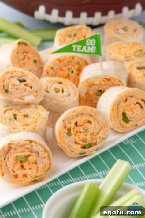 A bunch of Buffalo Chicken Pinwheels on a platter.
