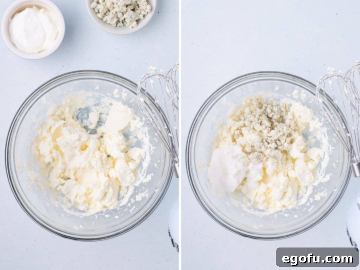 A bowl with cream cheese, mayo, and salt being mixed together.