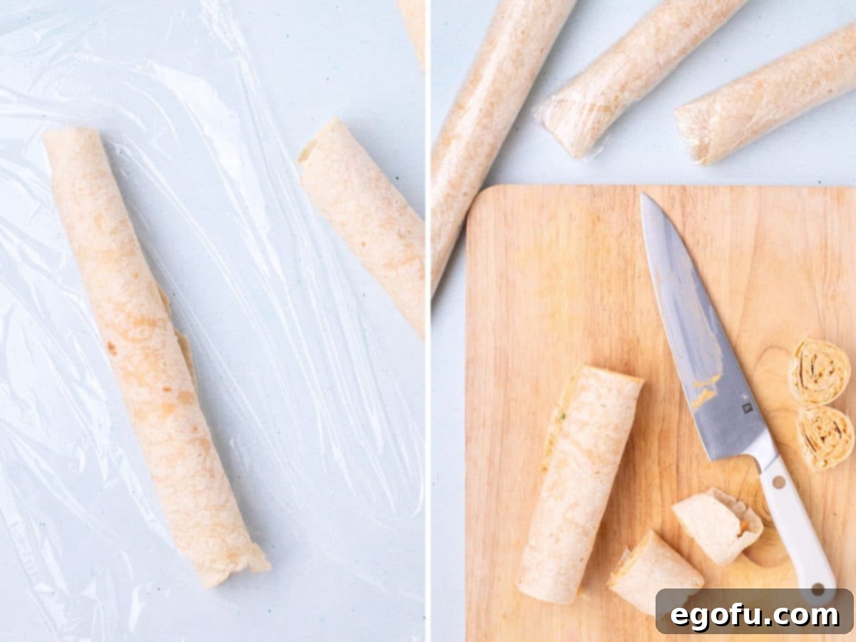 A rolled up tortilla with the mixture on a piece of plastic wrap and a knife cutting the tortilla.