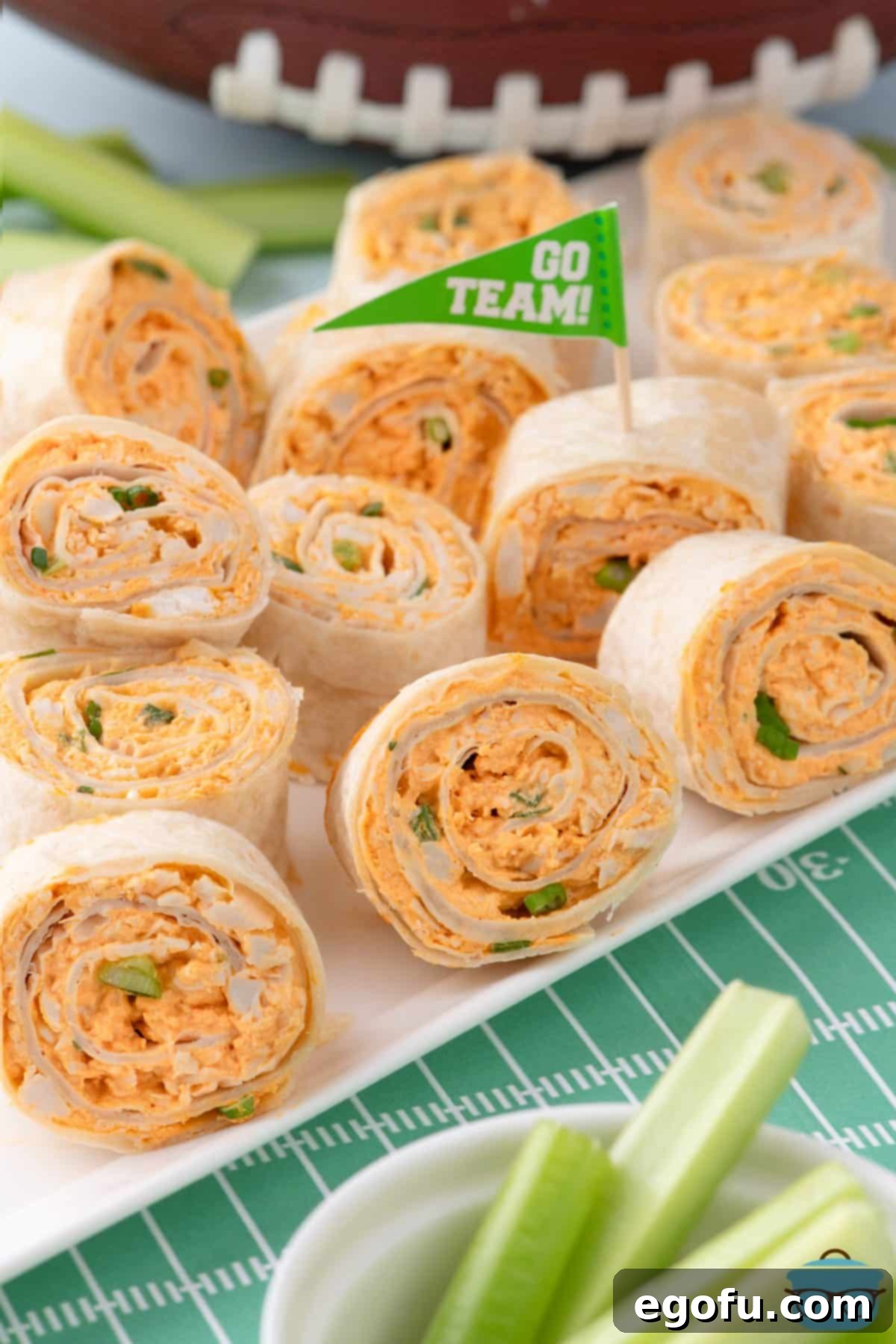 A bunch of Buffalo Chicken Pinwheels on a platter.