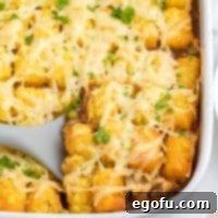 Closely looking down on a baking dish with Shepherd's Pie Tater Tot Casserole.