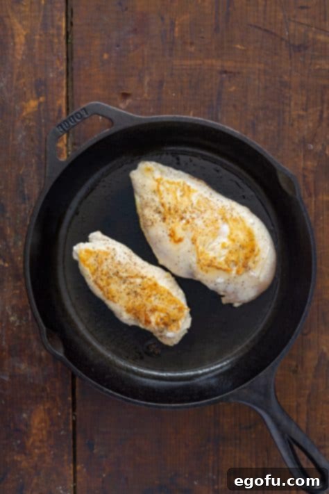 Effortless Slow Cooker Angel Chicken 10 Seared chicken in a skillet.