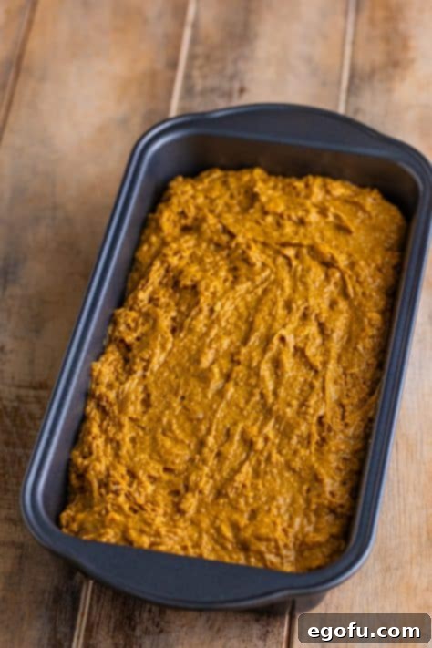 Ireland's Beloved Brown Loaf 11 A loaf pan with wet bread dough.