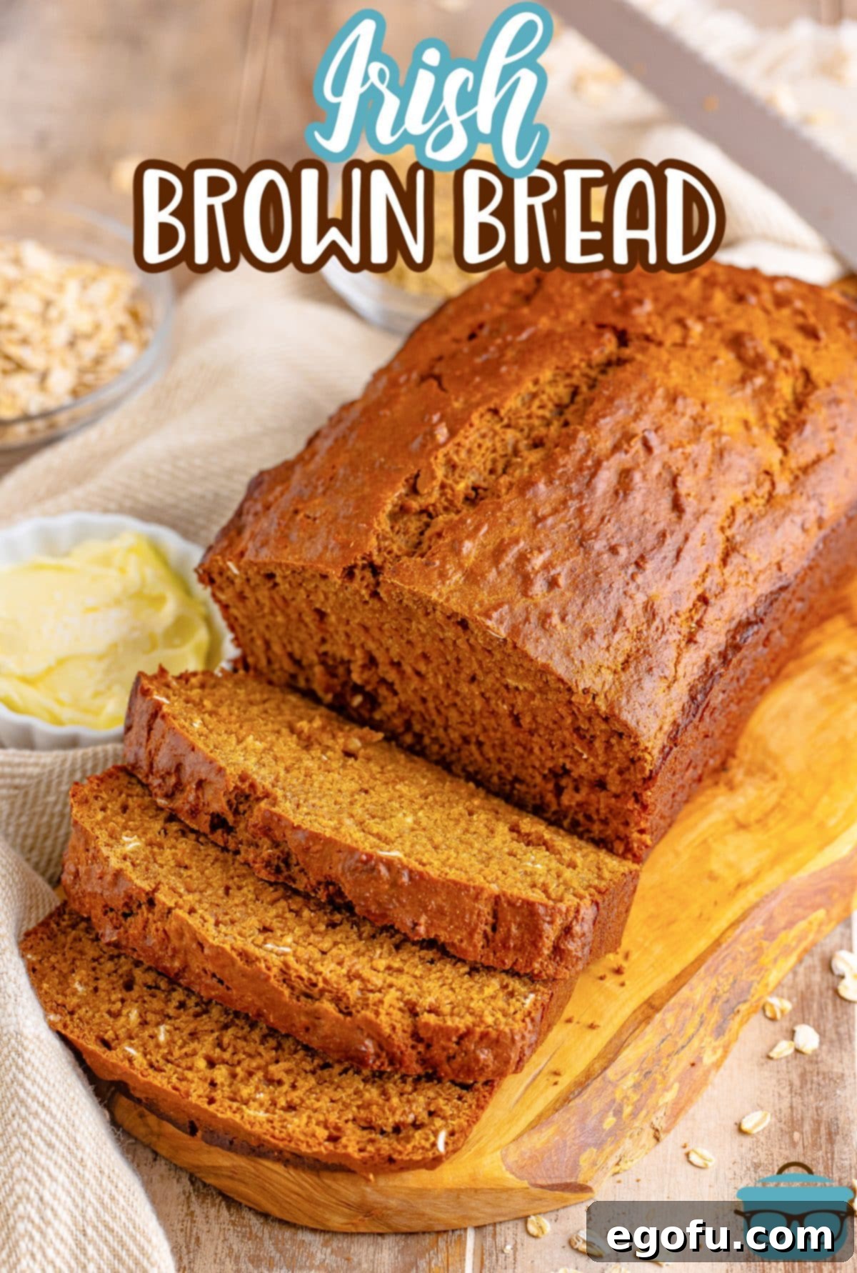Ireland's Beloved Brown Loaf 3 A rustic wooden cutting board holds a freshly baked loaf of Irish Brown Bread, with several thick slices already cut and arranged invitingly.