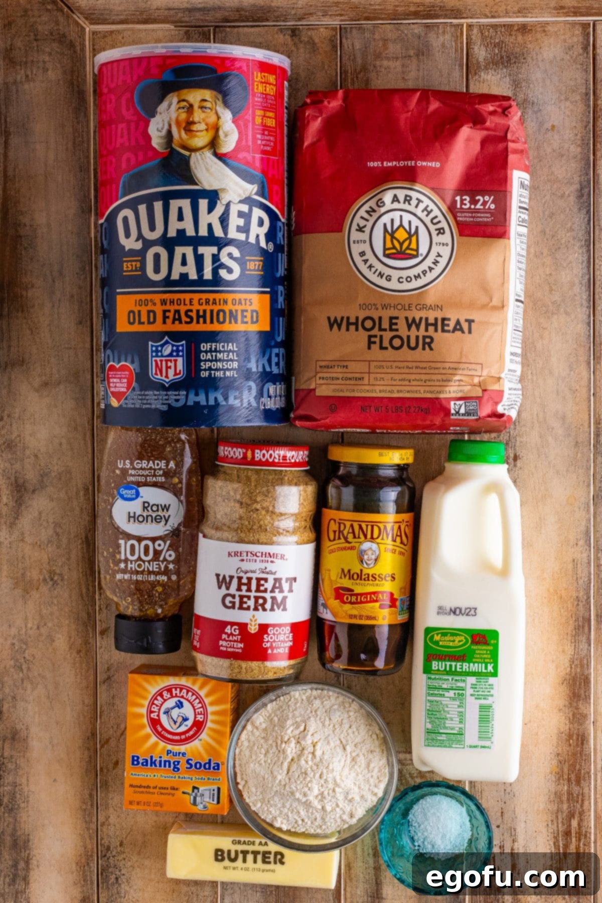 Ireland's Beloved Brown Loaf 4 A collection of all the necessary ingredients laid out for Irish Brown Bread: whole wheat flour, all-purpose flour, buttermilk, wheat germ, rolled oats, baking soda, salt, molasses, honey, and salted butter.