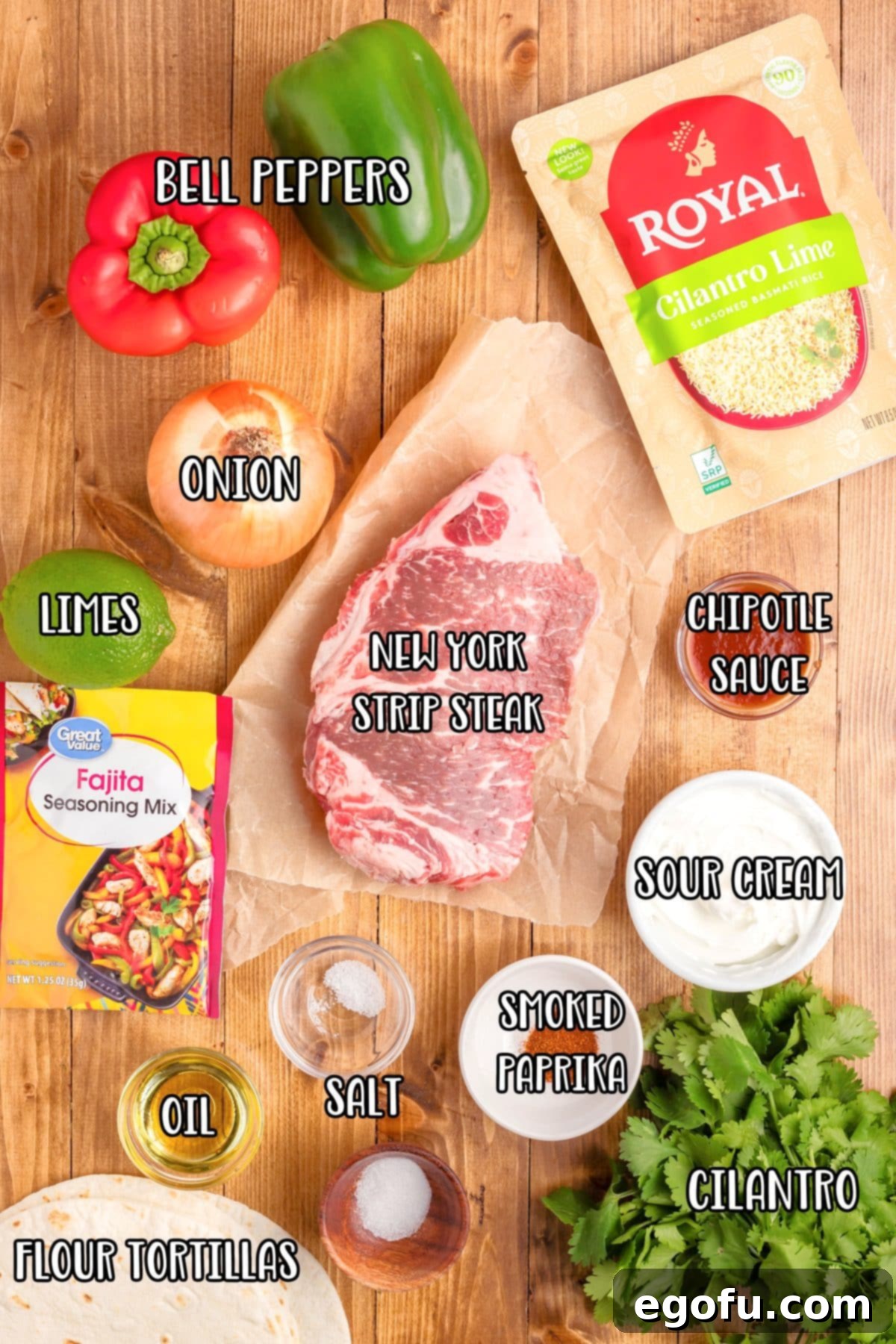 New York Strip Steak, red bell peppers, green bell peppers, yellow onion, oil, limes, fajita seasoning, flour shells, cilantro, cilantro lime rice, sour cream, chipotle sauce, sugar, smoked paprika, and kosher salt.