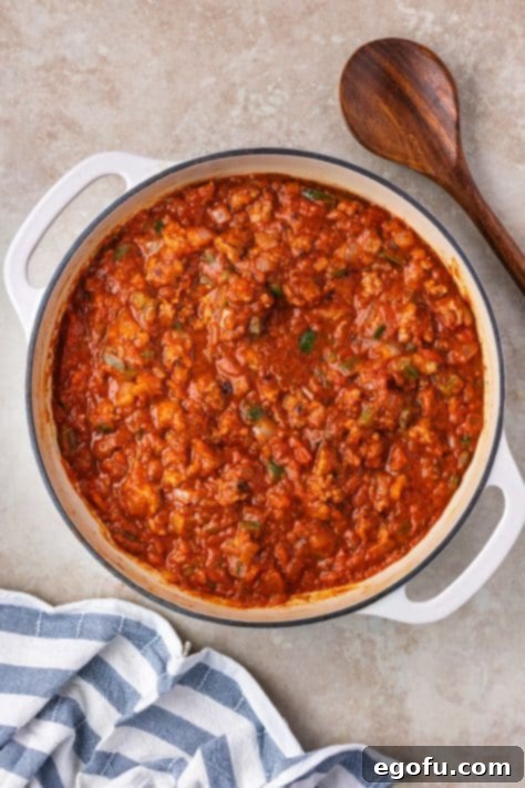 Peppers, onions, sausage, spices, and marinara sauce.