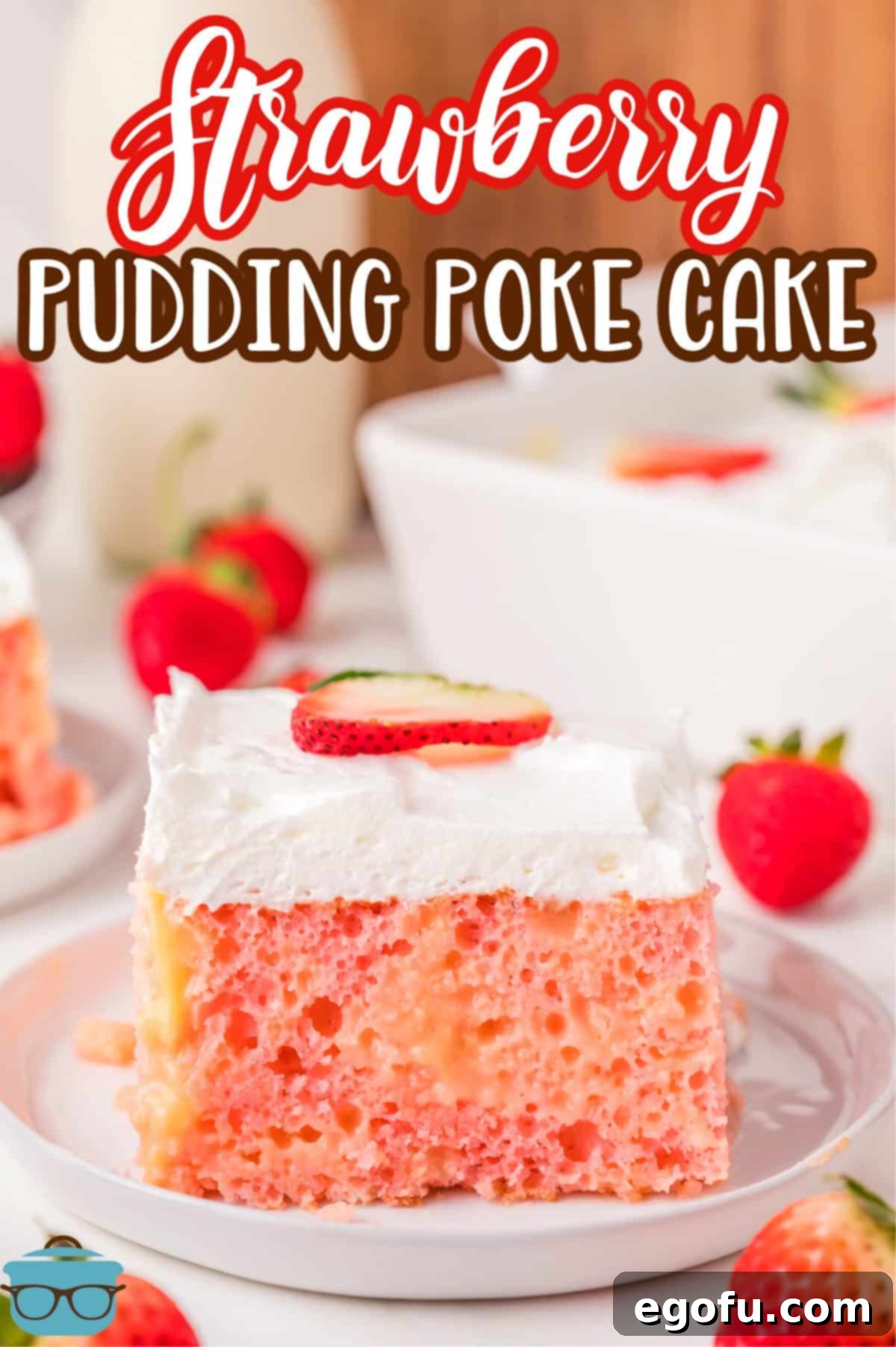 Velvety Strawberry Poke Cake Bliss 3 A dessert plate with a nice slice of Strawberry Pudding Poke Cake with fresh strawberries on top.