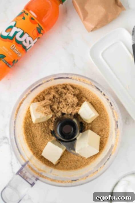 Zesty Orange Cream Pie 11 Butter and graham cracker crumbs in a food processor.