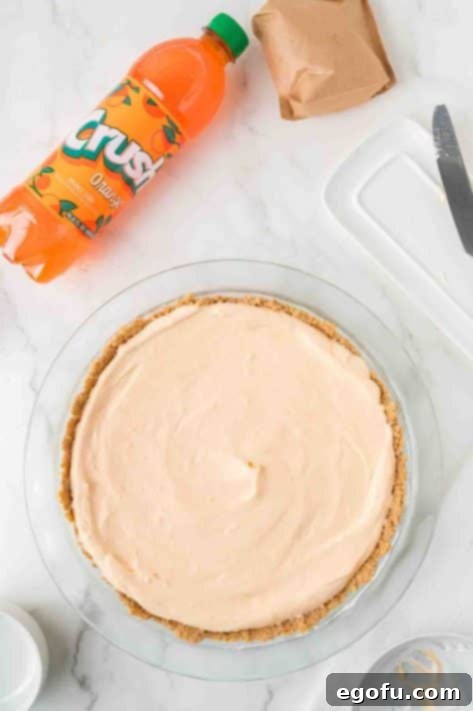 Zesty Orange Cream Pie 15 A crust with orange creamsicle filling inside.