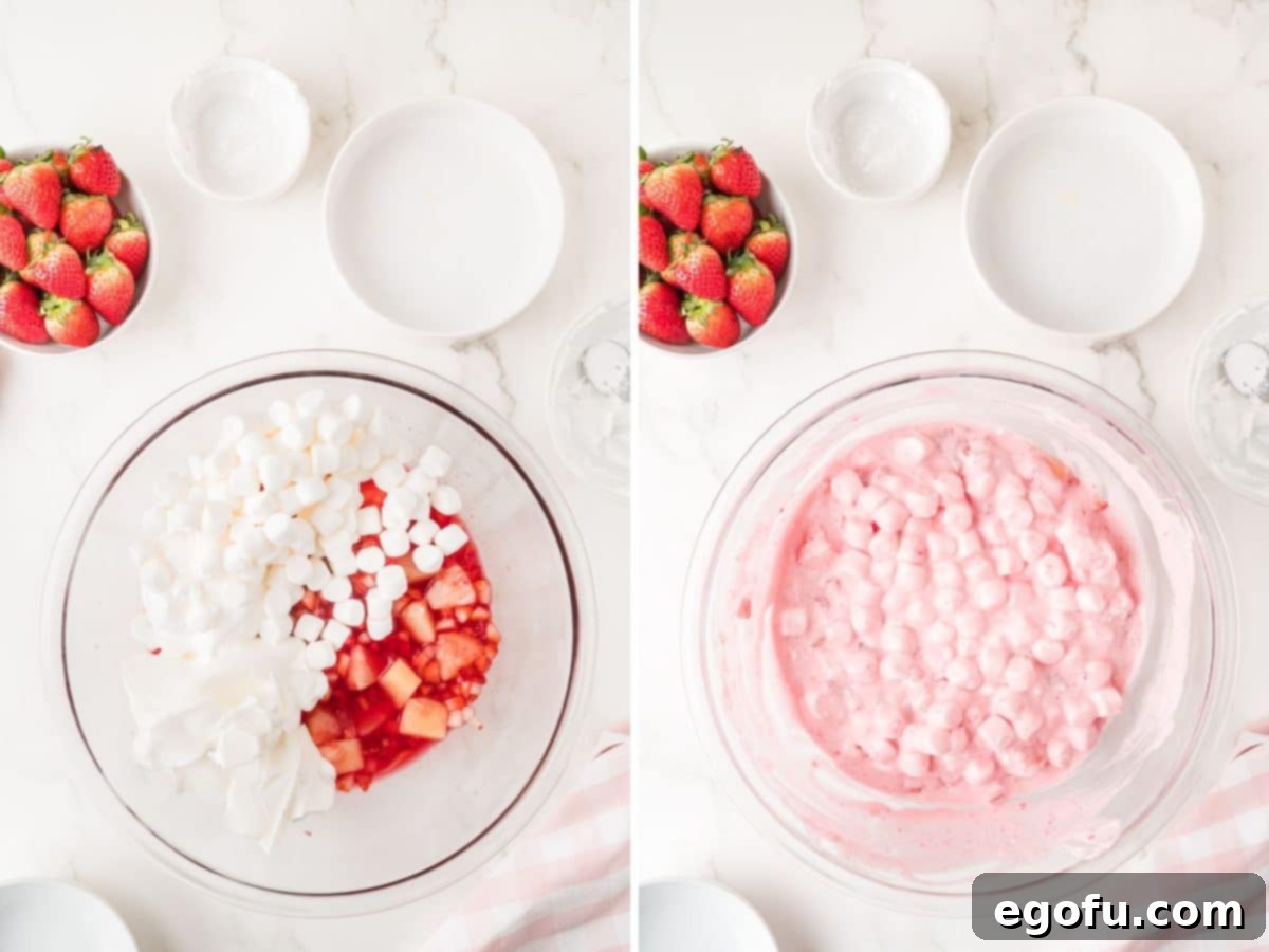 Whipped topping, marshmallow creme, and mini marshmallows added to the fruit and strawberry jello mixture.